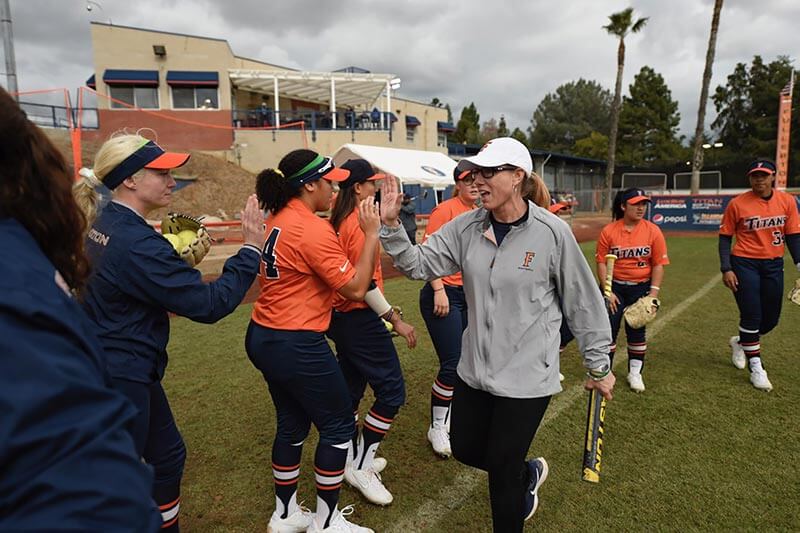 Kelly Ford high fives team members