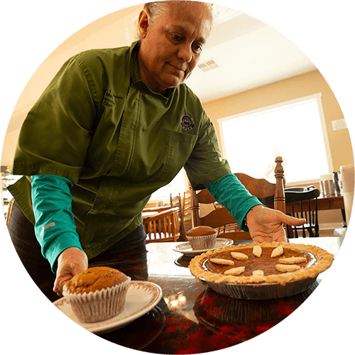 Teresa Zamora serves sweet potato pie and sweet potato muffins