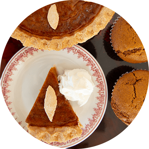 Slice of sweet potato pie and muffins